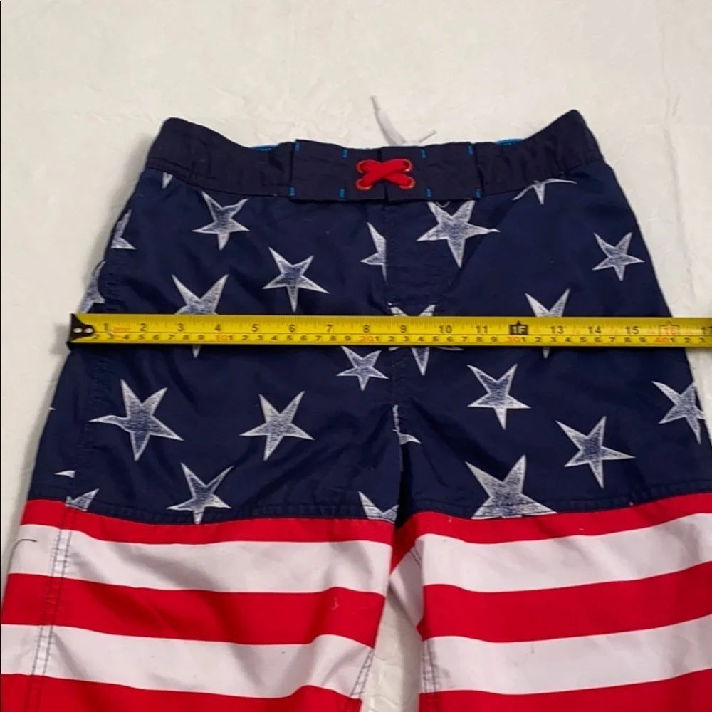 Cat and Jack American Flag red white blue swim trunks L = 12-14